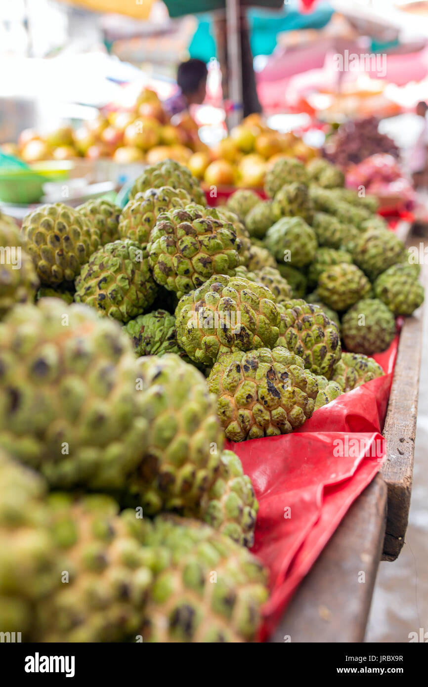 Custard apples for sale on market stall in Myanmar Stock Photo