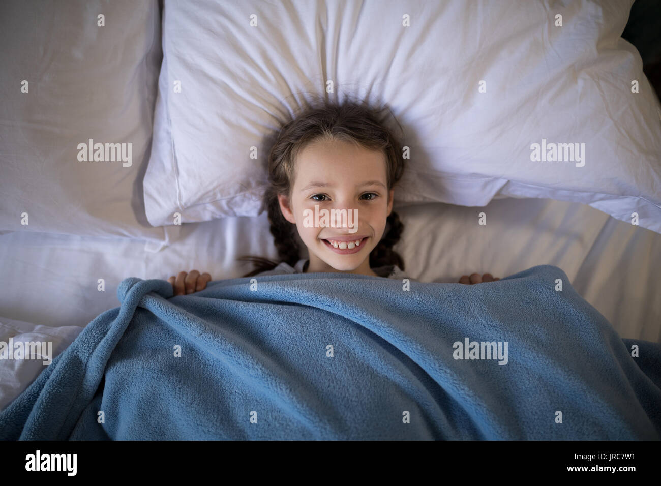 Girl lying on bed in hi-res stock photography and images - Alamy