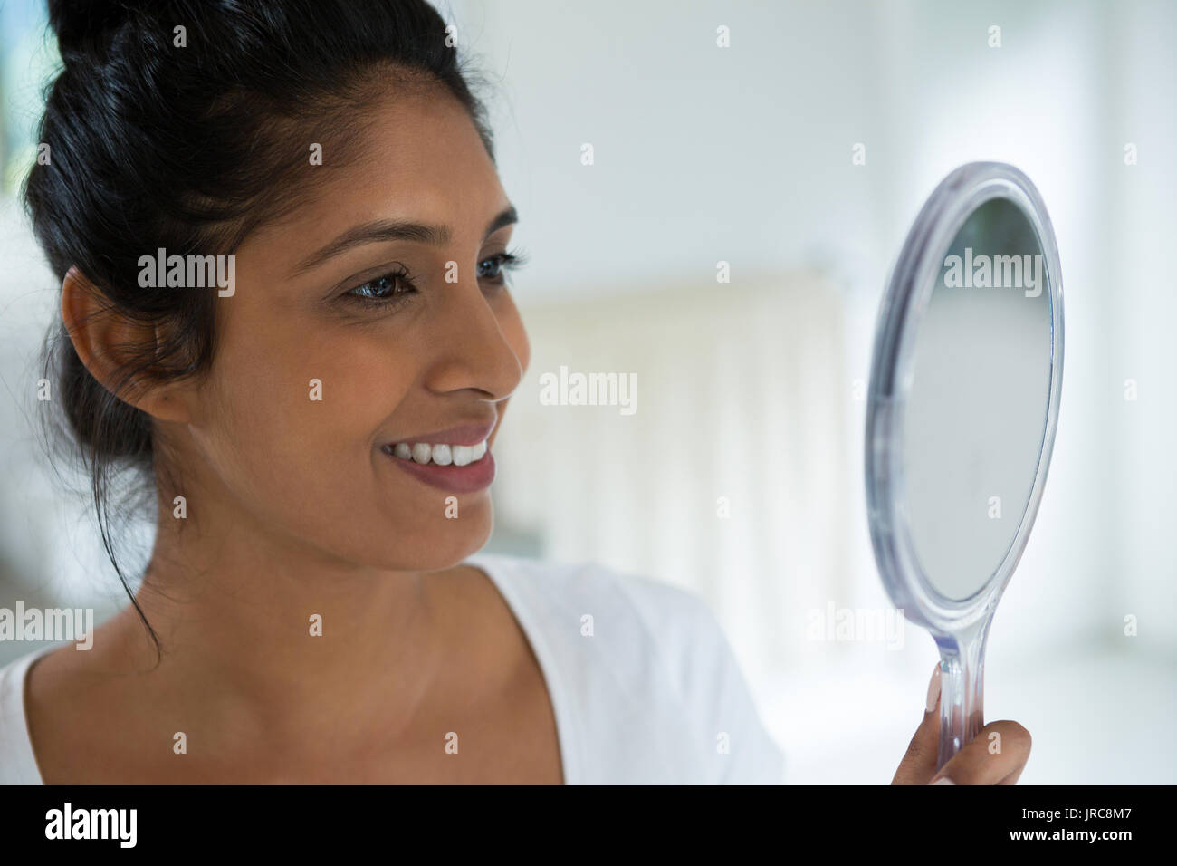 Woman holding hand mirror hi-res stock photography and images - Alamy