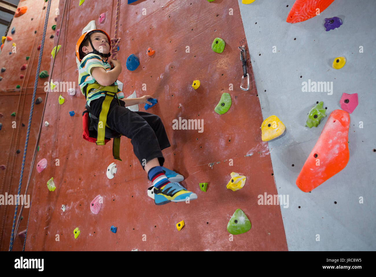 Boy indoor wall climbing helmet hi-res stock photography and images - Alamy