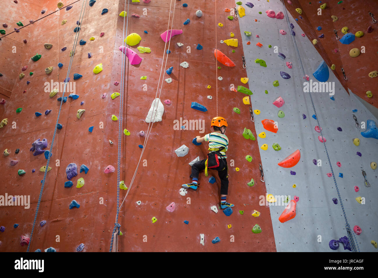 Boy indoor wall climbing helmet hi-res stock photography and images - Alamy