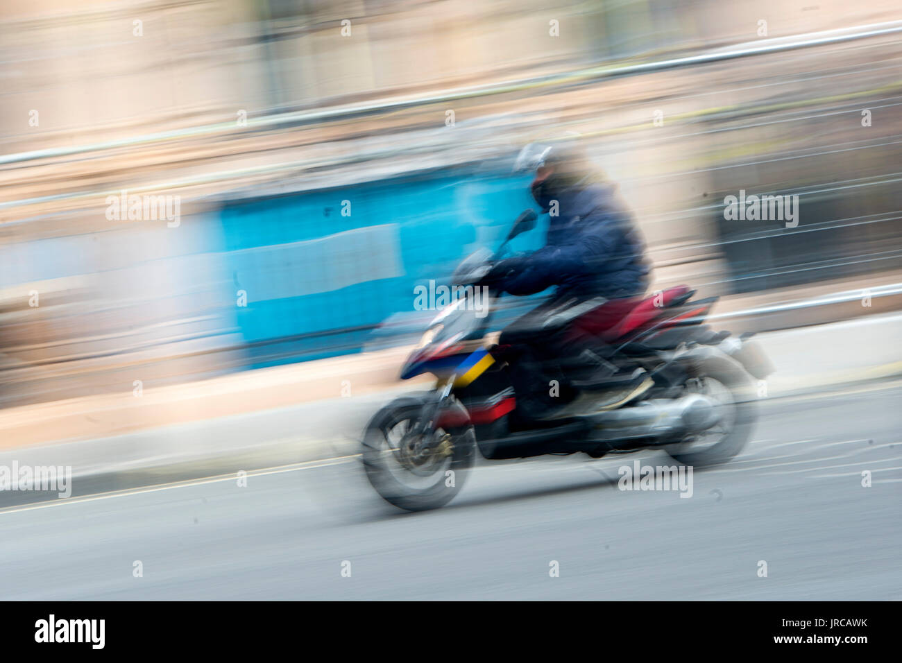 A moped rider in central London Stock Photo Alamy