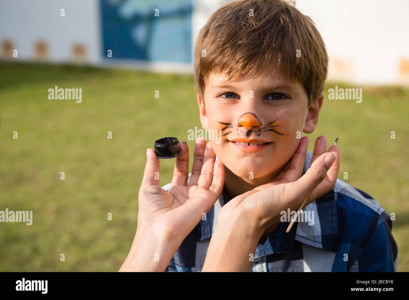 Boy with animal face paint hi-res stock photography and images - Alamy