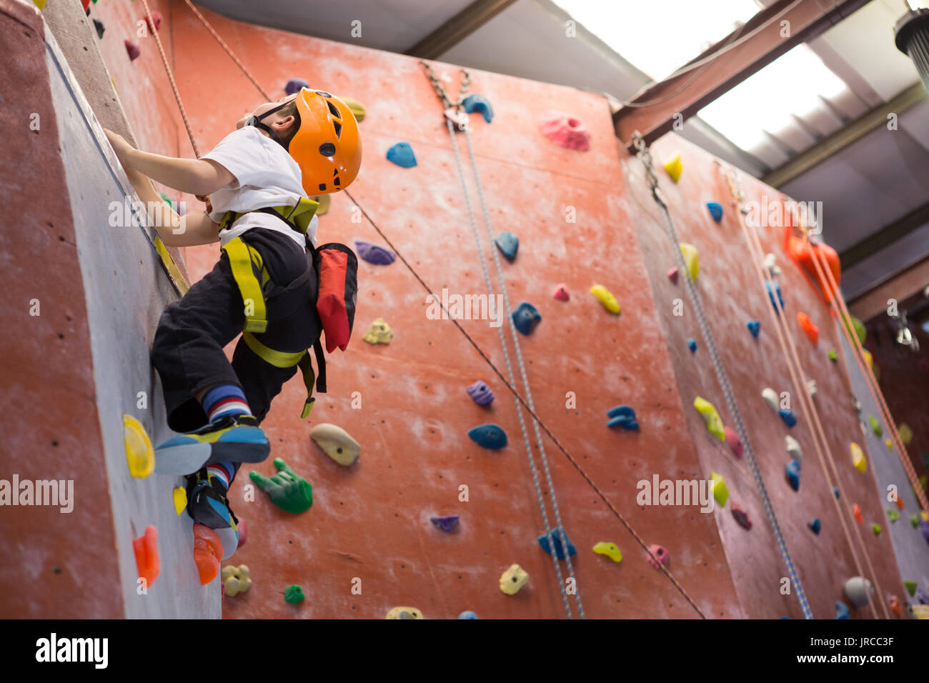 Boy indoor wall climbing helmet hi-res stock photography and images - Alamy