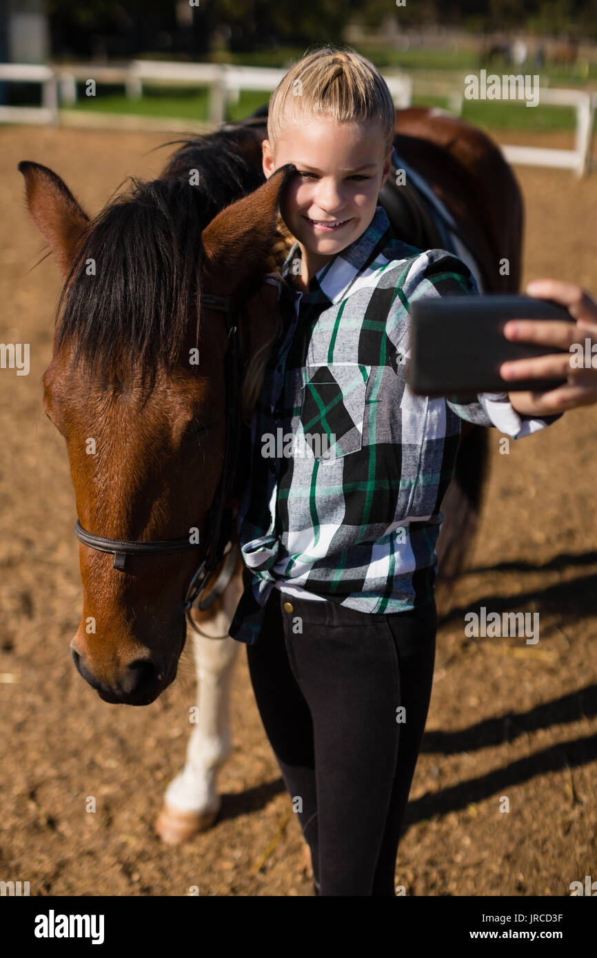 Girl taking a selfie with horse at the ranch Stock Photo Alamy