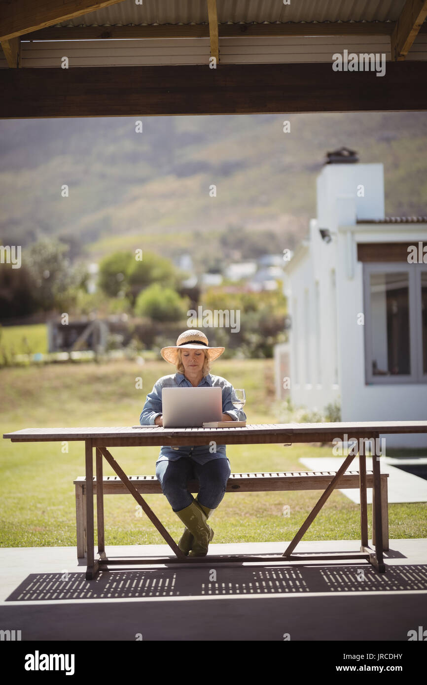 Senior woman sitting veranda hi-res stock photography and images - Alamy