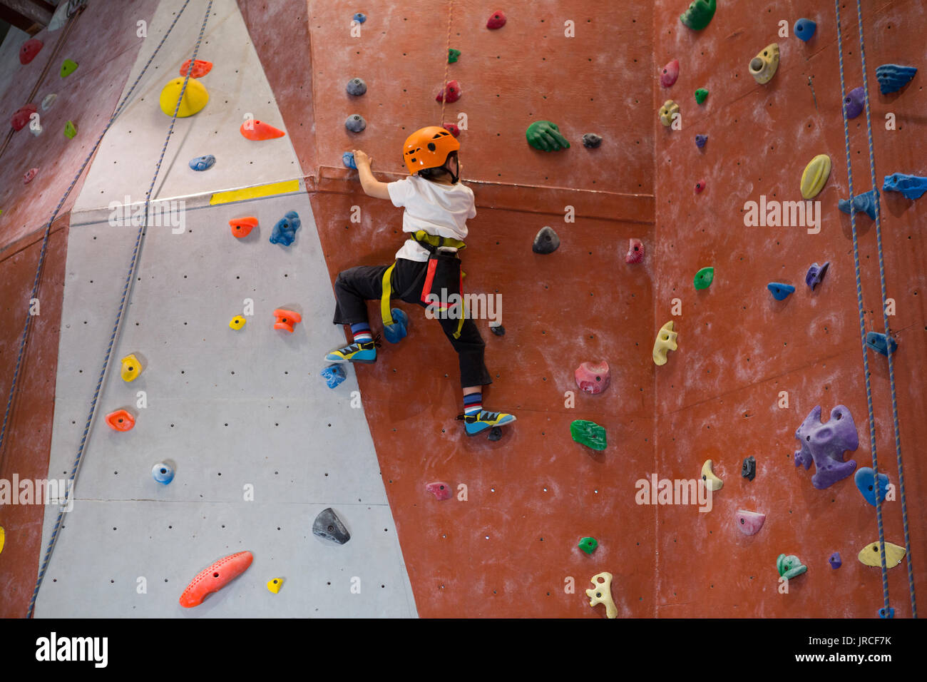 Boy indoor wall climbing helmet hi-res stock photography and images - Alamy