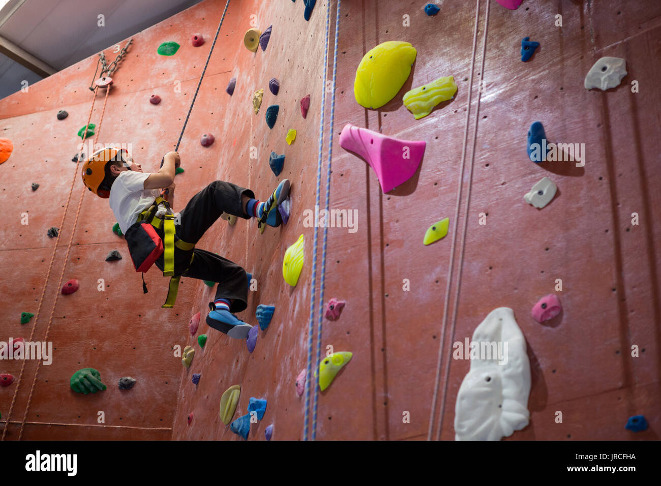 Boy indoor wall climbing helmet hi-res stock photography and images - Alamy