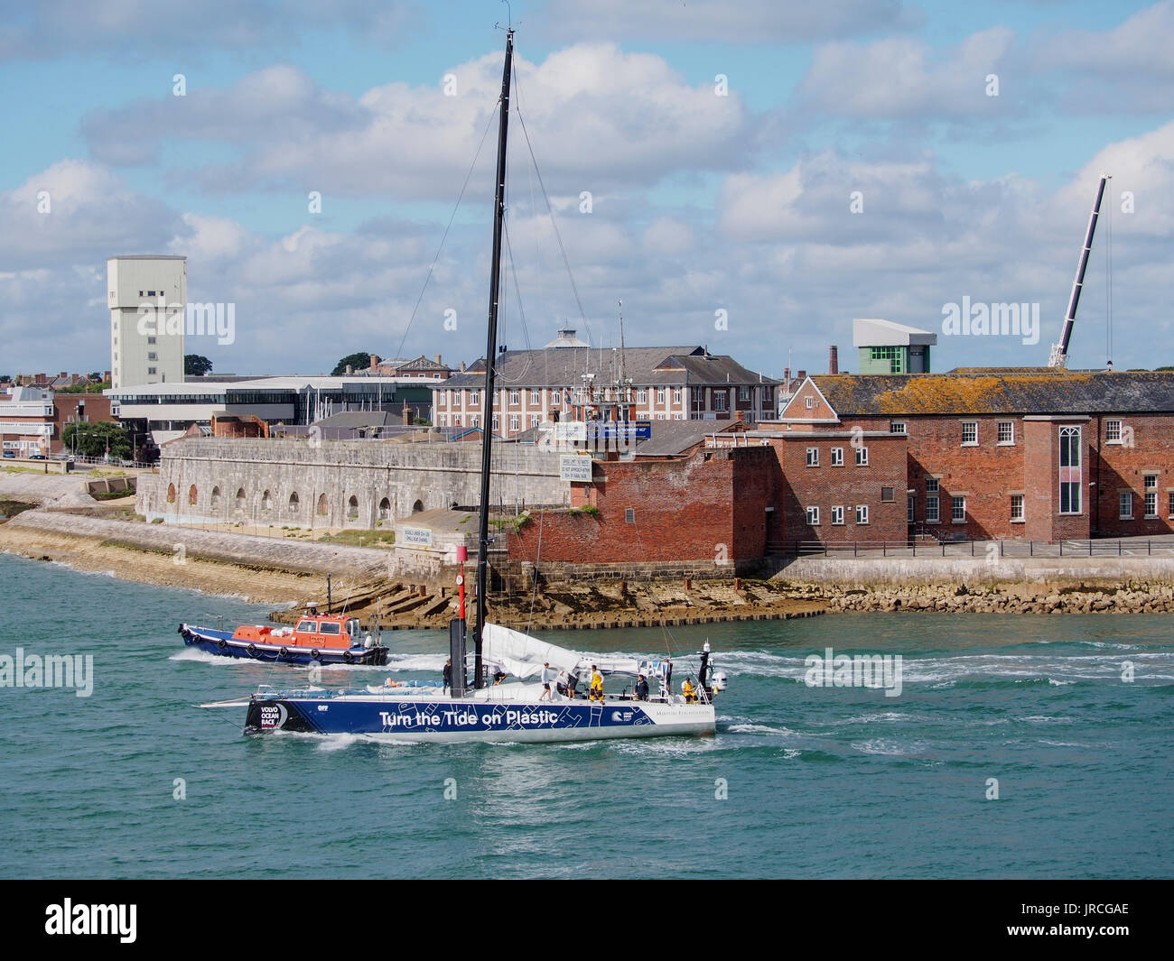 The yacht of team 'Turn the tide on Plastic' preparing for the Volvo ocean race in Portsmouth Harbour Stock Photo