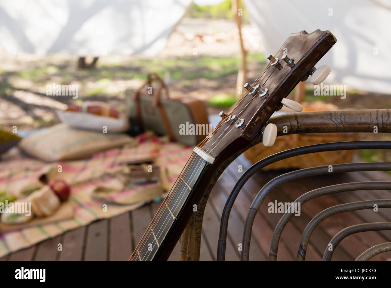 Cropped image of guitar in tent Stock Photo