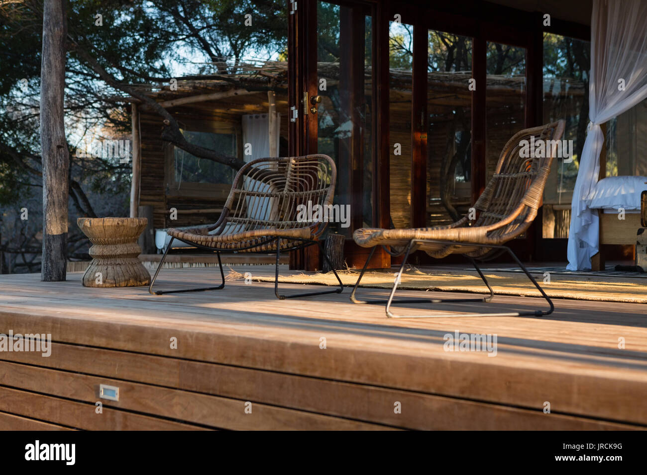 Empty chairs at porch Stock Photo - Alamy