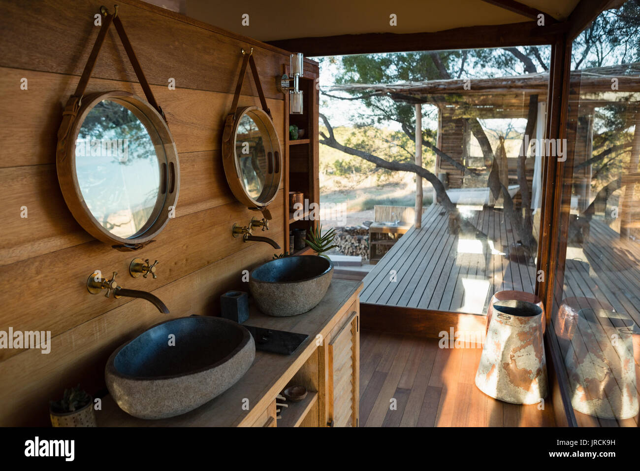 Mirrors over sink in house Stock Photo