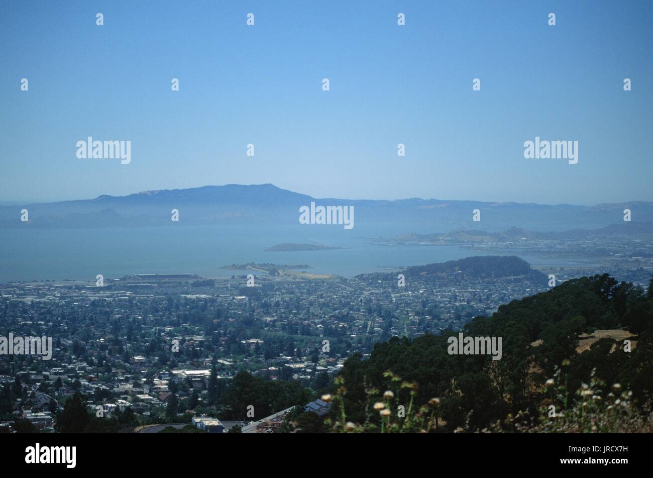 Mount Tamalpais, the San Francisco Bay, and Berkeley are visible on a hazy day from the Berkeley Hills, Berkeley, California, June 19, 2017. Stock Photo