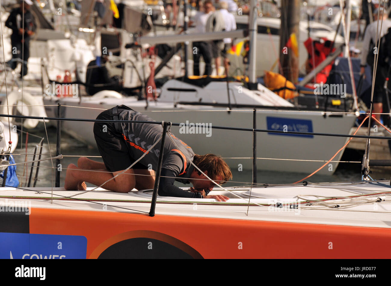 yachts racing and atmosphere with crowds and sailing at cowes week