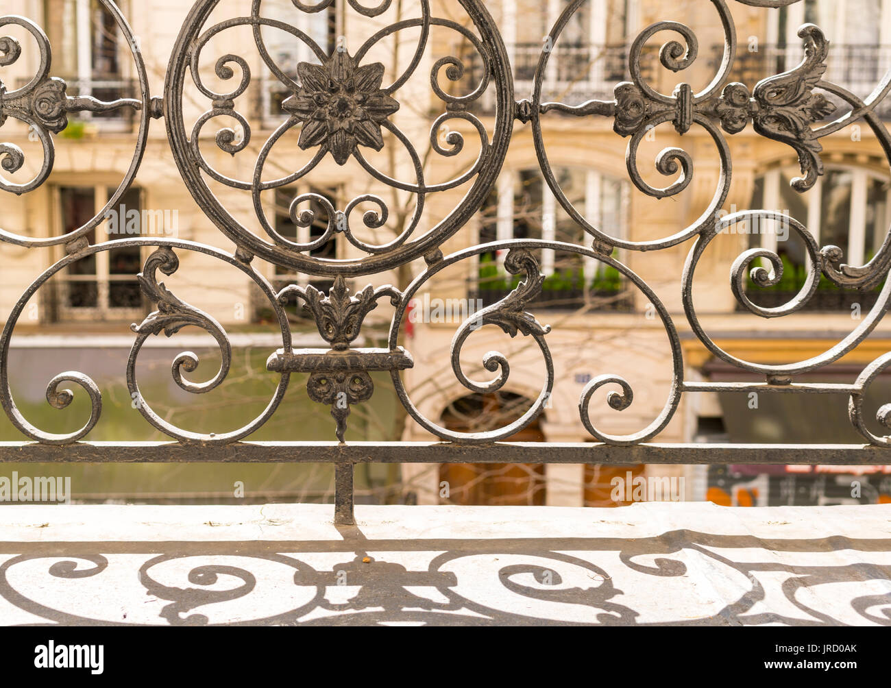 Balcony with decorative railing and shutters in Paris, France Stock Photo