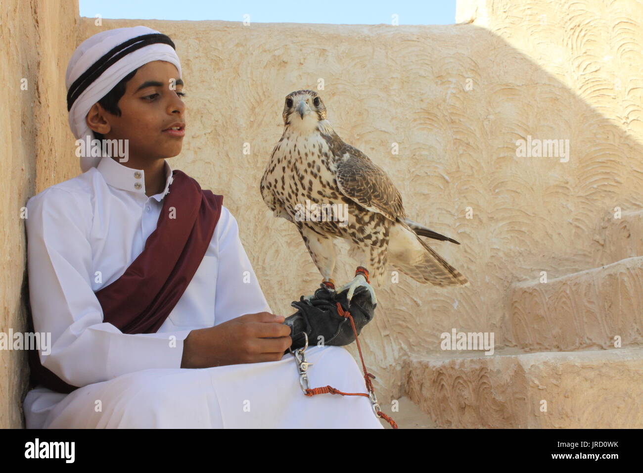 Qatar boy in traditional costume hires stock photography and images