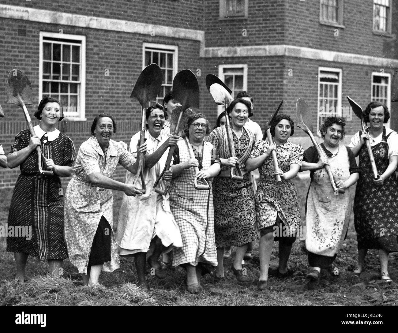 Digging for Victory! Women with spades ready for action during World War Two London 1940s. Dig for victory Londoners Second World War Stock Photo