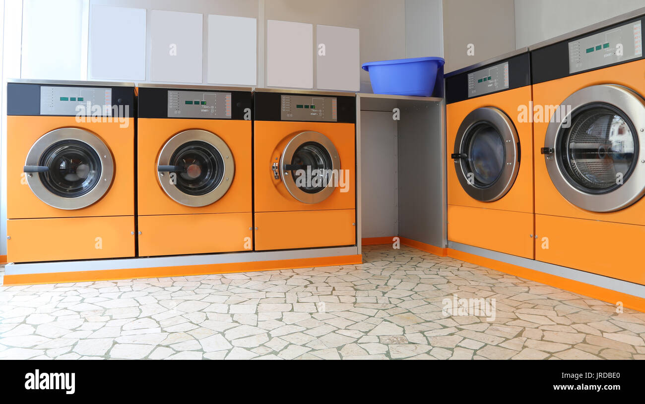 Automatic launderette with five washers for washing cloths Stock Photo