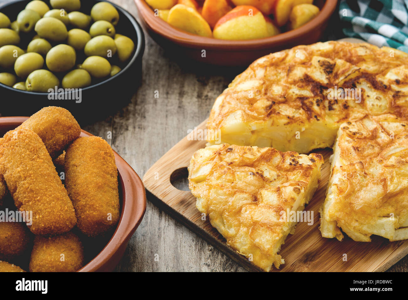 Traditional spanish tapas. Croquettes, olives, omelette, ham and