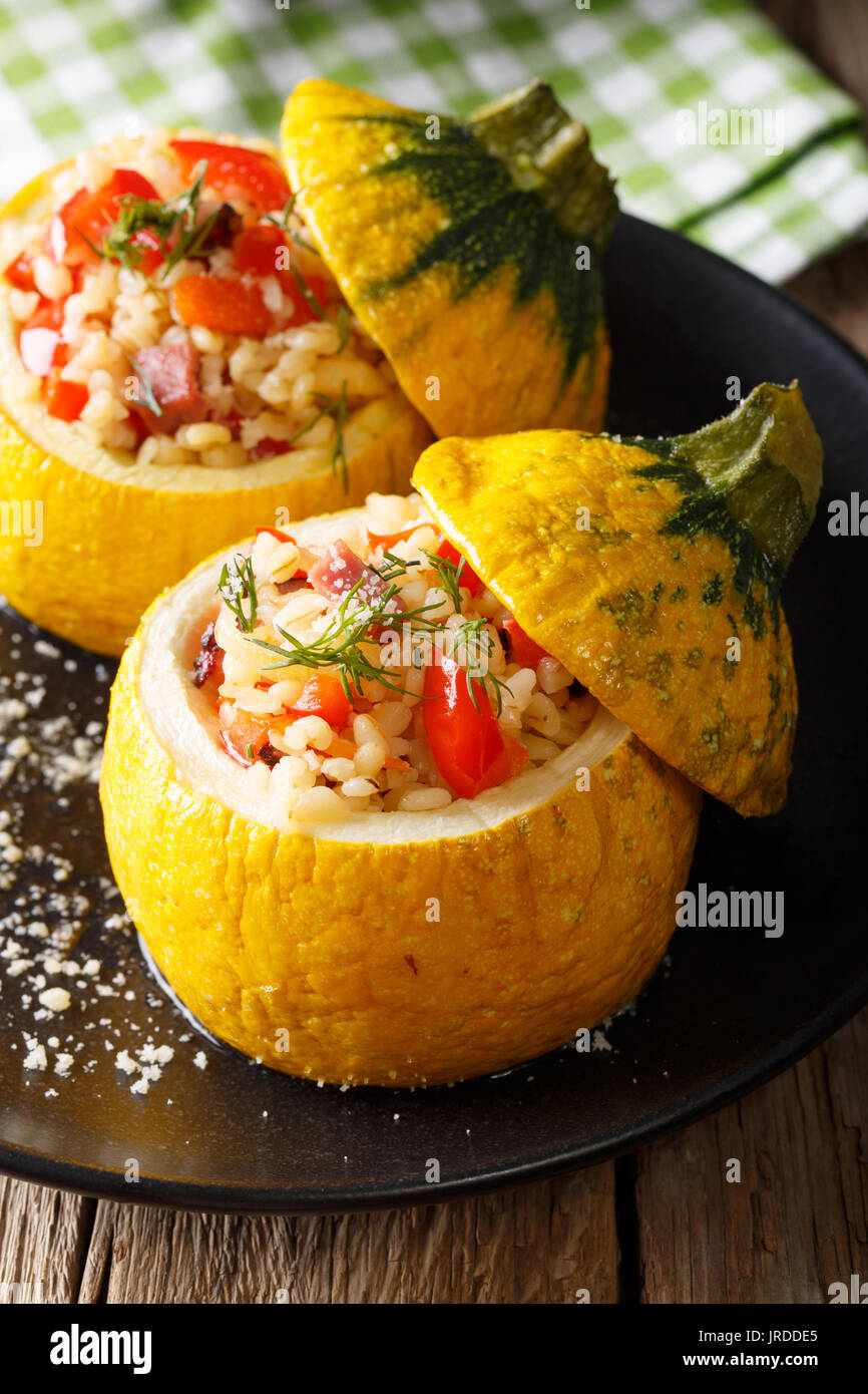 Baked yellow zucchini stuffed with bulgur, meat and vegetables closeup