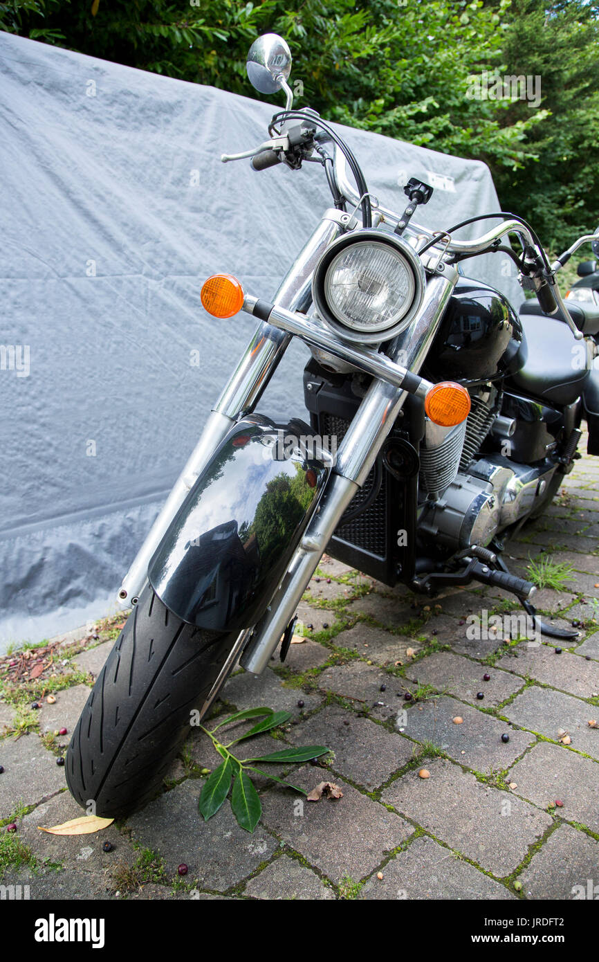 Black and Chrome Honda Motorbike Parked on Drive Way Stock Photo 