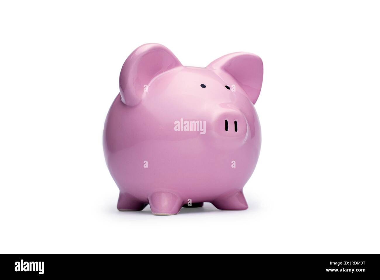 Little ceramic pink piggy bank or moneybox on a white background conceptual of saving money, finances, investment, security and goals Stock Photo