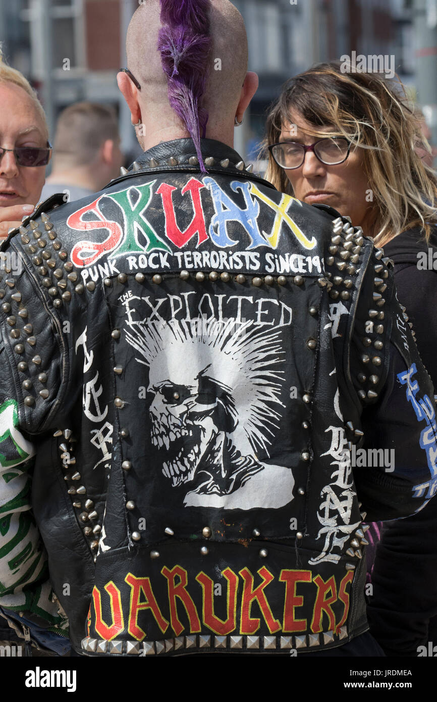 Blackpool Rebellion Festival Punk fashion The clothing, hairstyles, body  modifications punk style jackets, denim and leather subculture. These Styles  carried slogans, not logos and are modeled on bands like The Exploited to