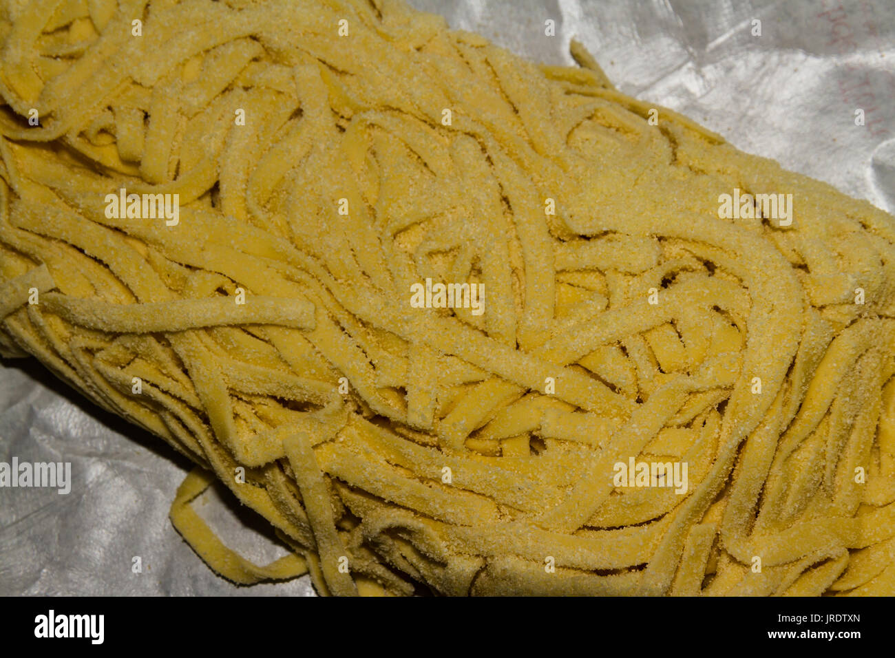 Freshly made tagliatelli pasta dusted with semolina Stock Photo