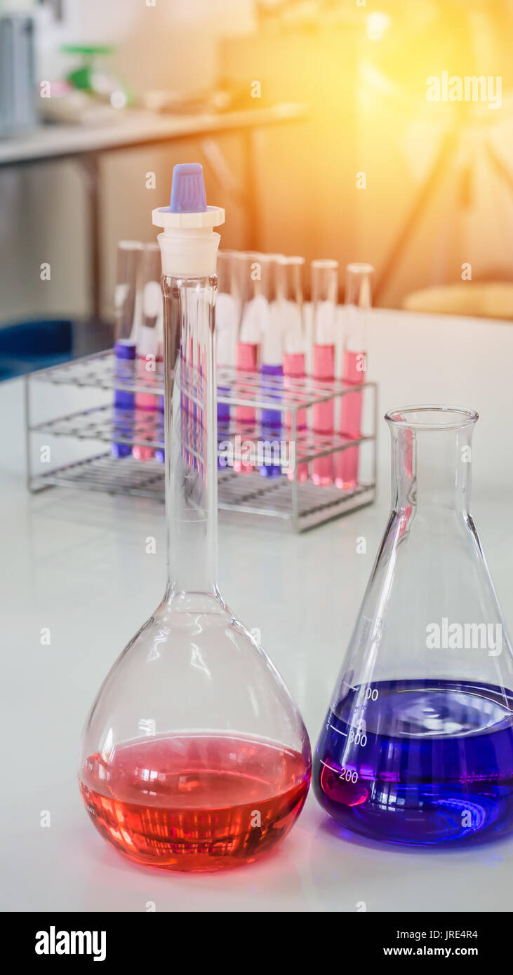 Different laboratory test tubes with colored liquid and with reflection Stock Photo