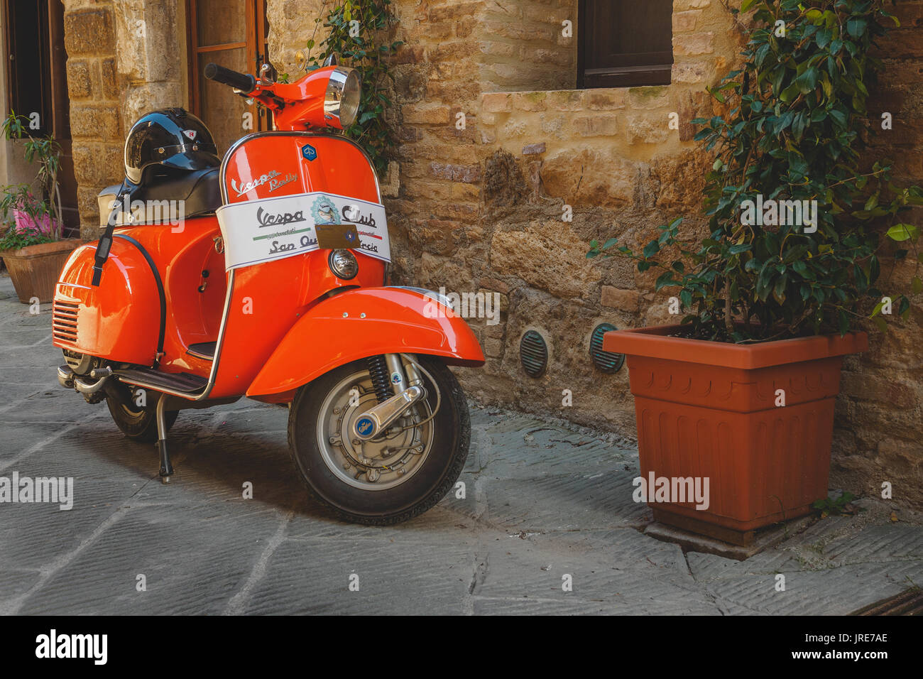 Vintage Vespa Piaggio parked in a street of a Tuscan town. Italy, 2017. Stock Photo