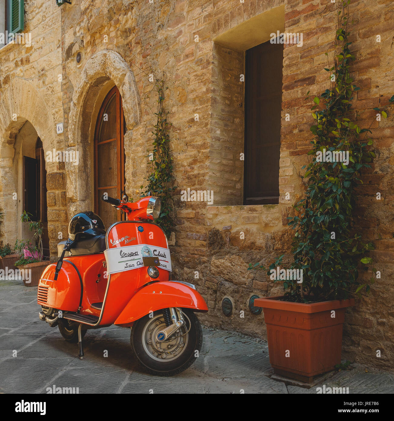 Vintage Vespa Piaggio parked in a street of a Tuscan town. Italy, 2017. Stock Photo