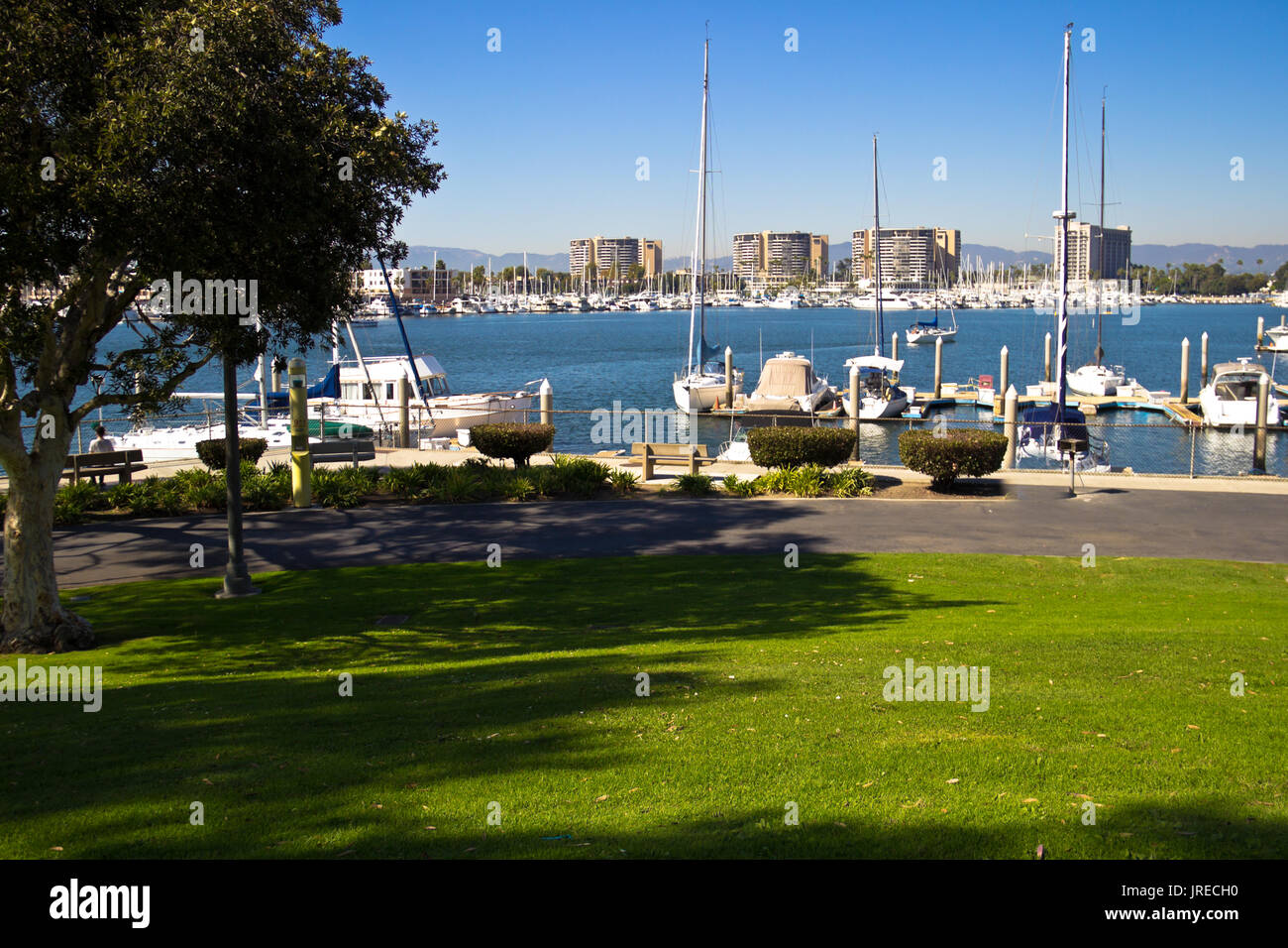 Shaded benches provide a view of the marina at Marina Del Rey, California. Stock Photo