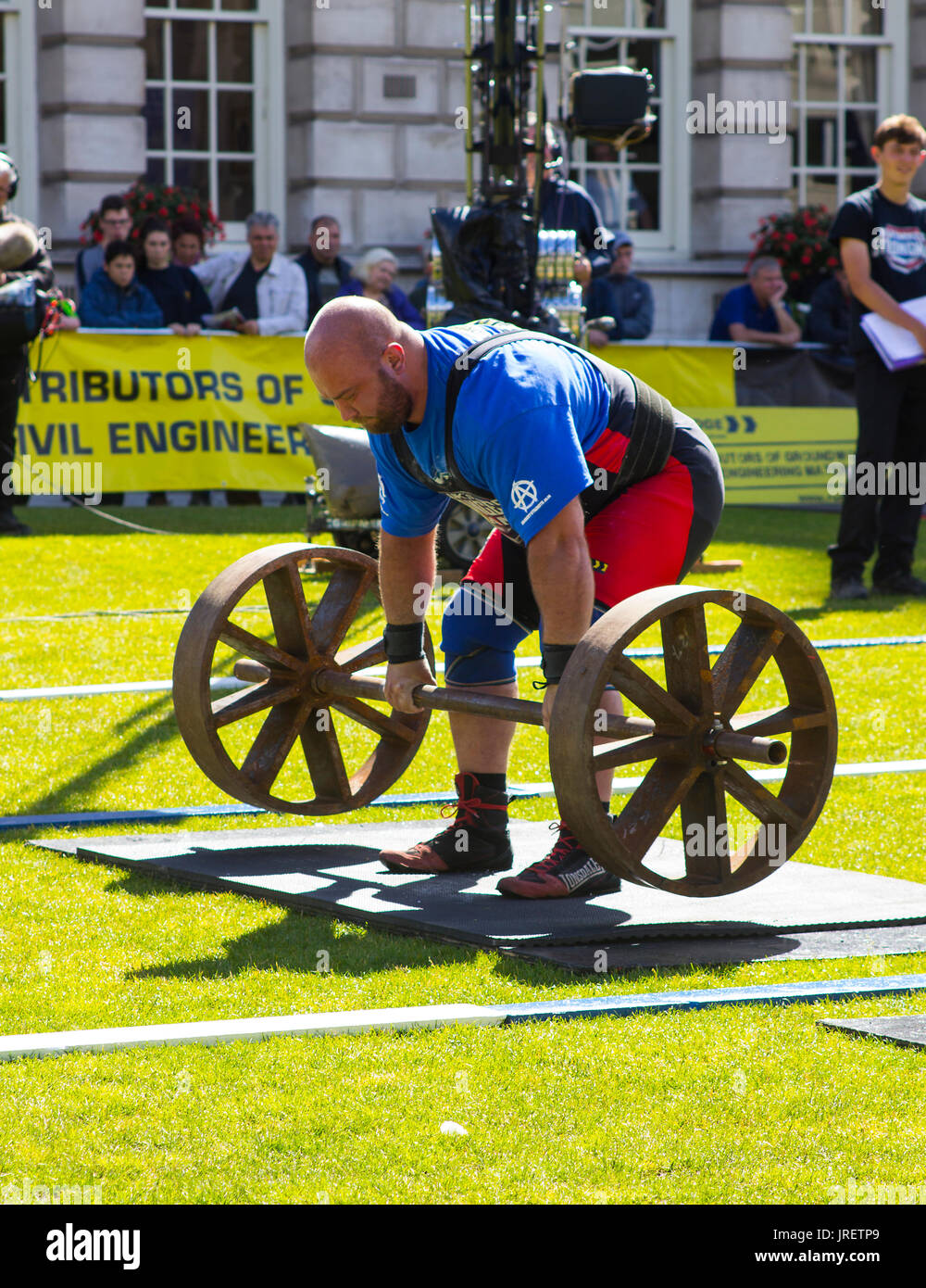 Competitors strain in the power lifting heat of the Ultimate Strongest Man competition that was held and televised in the grounds of the Belfast City Stock Photo