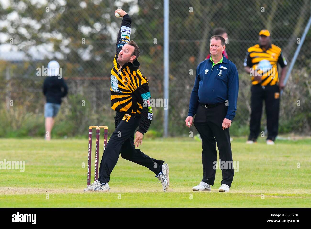 Easton, Portland, Dorset, UK.  4th August 2017.  Lashings captain Chris Schofield bowling during the Portland Red Triangle match v Lashings All Stars at the Reforne cricket ground at Easton in Dorset.  Photo Credit: Graham Hunt/Alamy Live News Stock Photo