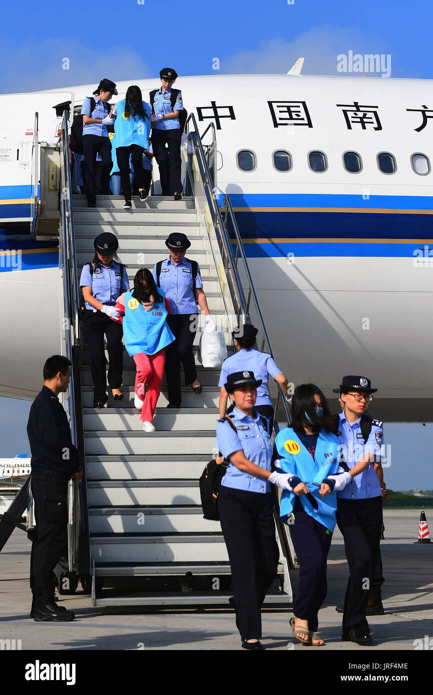 Changchun, China's Jilin Province. 5th Aug, 2017. Suspects in telecom and online fraud cases are brought back to China from Fiji at Changchun Longjia International Airport, Changchun, northeast China's Jilin Province, Aug. 5, 2017. A total of 77 suspects in telecom and online fraud cases have been brought back to China from Fiji, the Ministry of Public Security announced Saturday. The suspects are accused in more than 50 cases involving more than 6 million yuan (892,000 U.S. dollars). Credit: Lin Hong/Xinhua/Alamy Live News Stock Photo