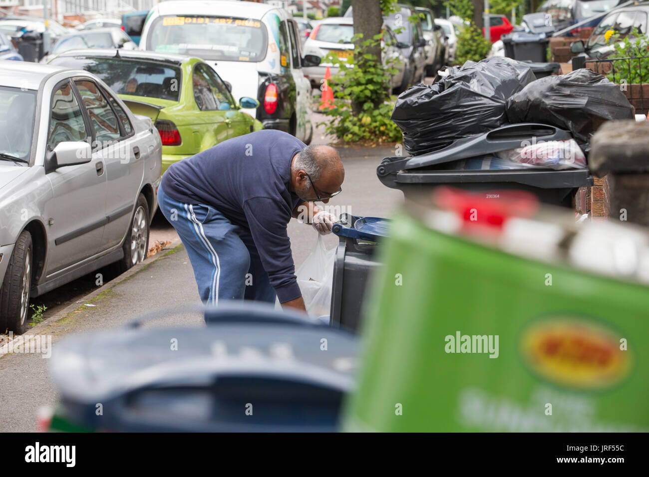 Refuse rubbish garbage builds up as Birmingham Council refuse collectors go on strike. UK August