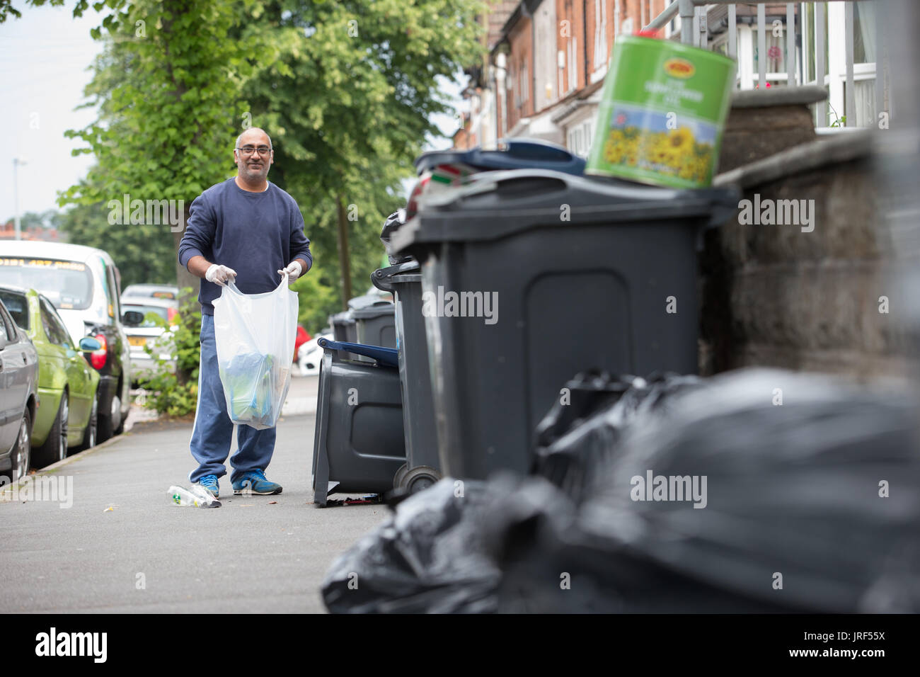 Refuse rubbish garbage builds up as Birmingham Council refuse collectors go on strike. UK August