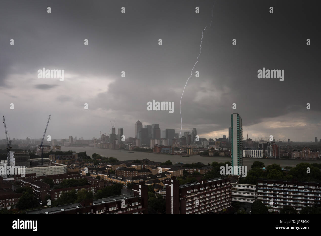 London, UK. 5th Aug, 2017. UK Weather: Afternoon lightning strike over Canary Wharf business park buildings in east London. Credit: Guy Corbishley/Alamy Live News Stock Photo