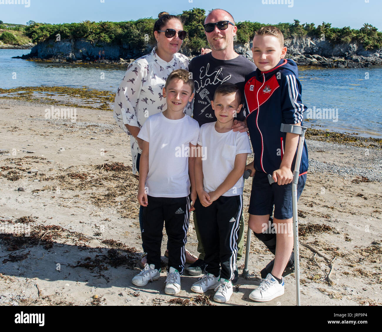 Schull, West Cork, Ireland. 5th Aug, 2017. The South West of Ireland has basked in sunshine over the last two days, with rain forecast from tomorrow and the rest of the week, families are taking the opportunity to hit the beaches.  Pictured at Schull beach are Heather, Liam, Anthony, Dara and Nathan Cronin frrom Ballingeary, West Cork.  Credit: Andy Gibson/Alamy Live News. Stock Photo