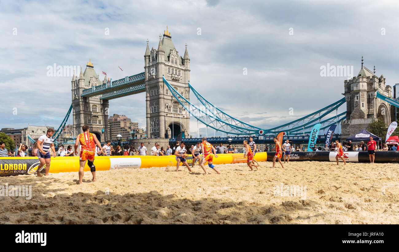 City Hall, London, UK, 5th August 2017. The Doom Platoon play Sandbaggers A in front of Tower Bridge. Tourists and Londoners watch as a total of 20 teams compete in Saturday's London Beach Rugby, now held in its 5th year. The event is free to spectators. London Beach Rugby is a 5 a side touch rugby tournament. Credit: Imageplotter News and Sports/Alamy Live News Stock Photo