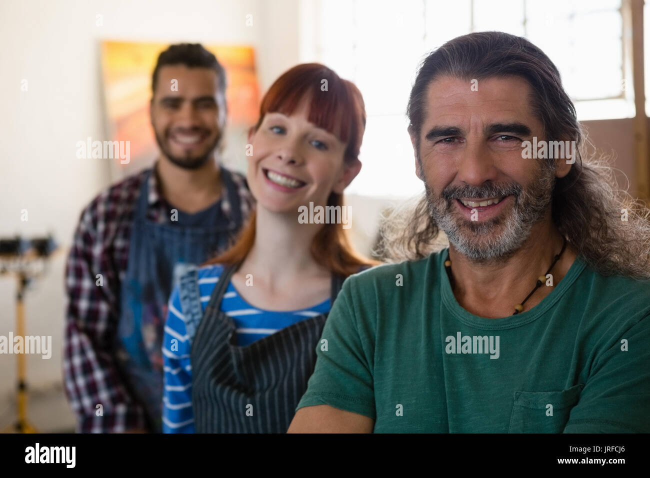 Portrait of happy adult students in art class Stock Photo
