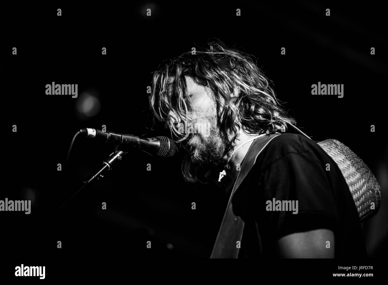 Edward Sharpe and the Magnetic Zeros performing at a music festival in British Columbia Canada in black and white. Stock Photo