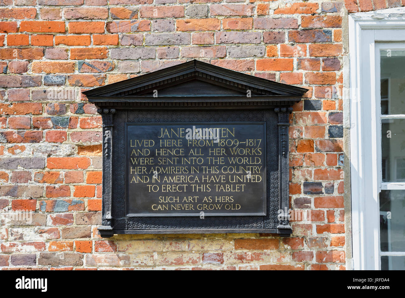 Memorial plaque on the wall of Jane Austen's House Museum in Chawton, Hampshire, southern England, UK Stock Photo