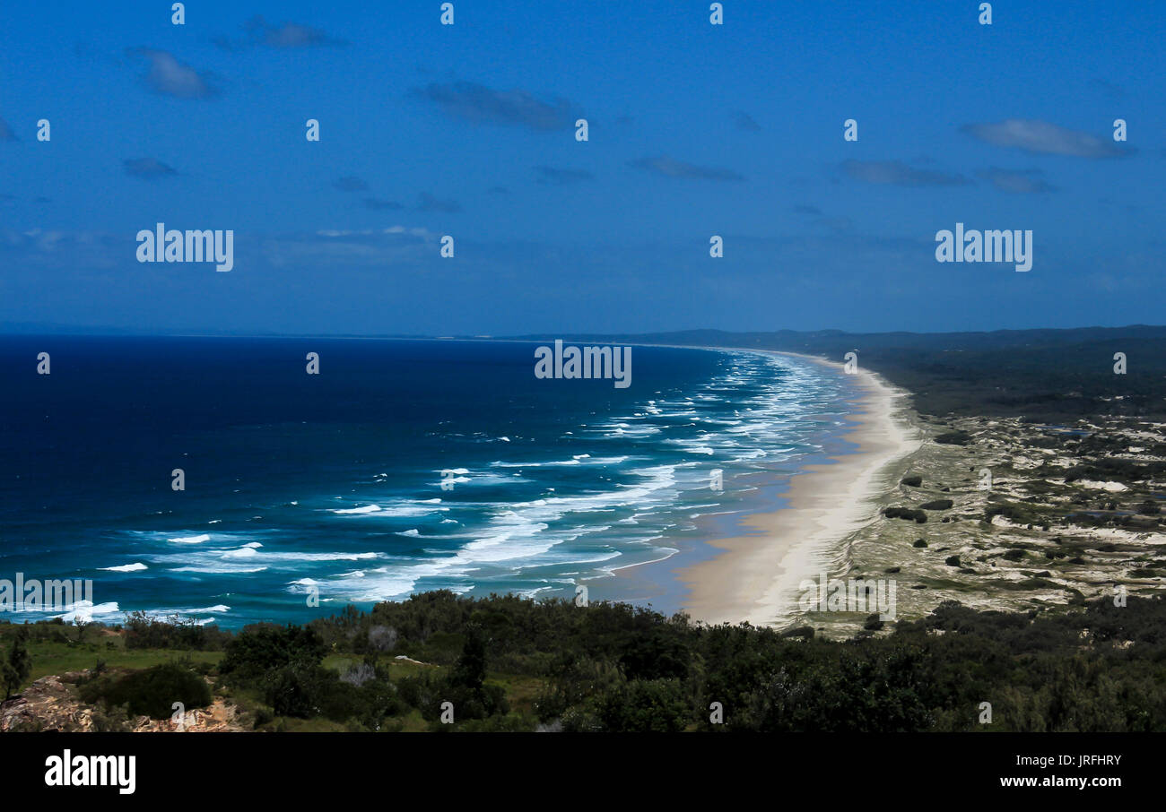 Ocean waves rolling onto sandy beach at Moreton Island, Queensland Australia Stock Photo