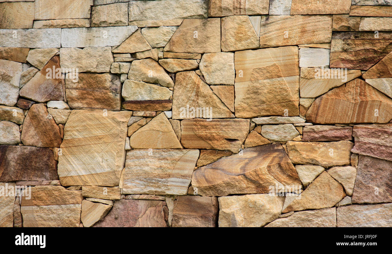 Sandstone brick decorative wall ideal as background Stock Photo