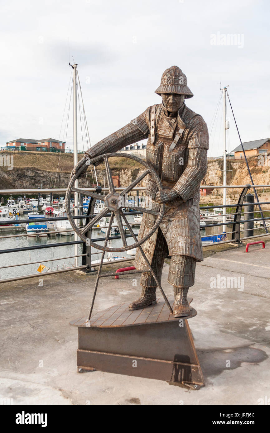The Coxswain statue sculptured by South Hetton artist, Ray Lonsdale, and situated at the marina at Seaham,in north east England Stock Photo