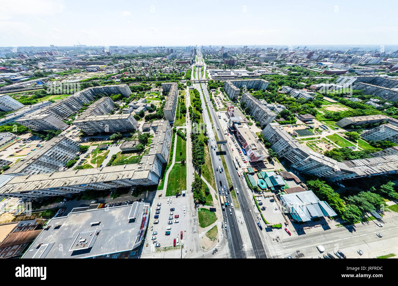 Aerial city view with crossroads and roads, houses, buildings, parks ...