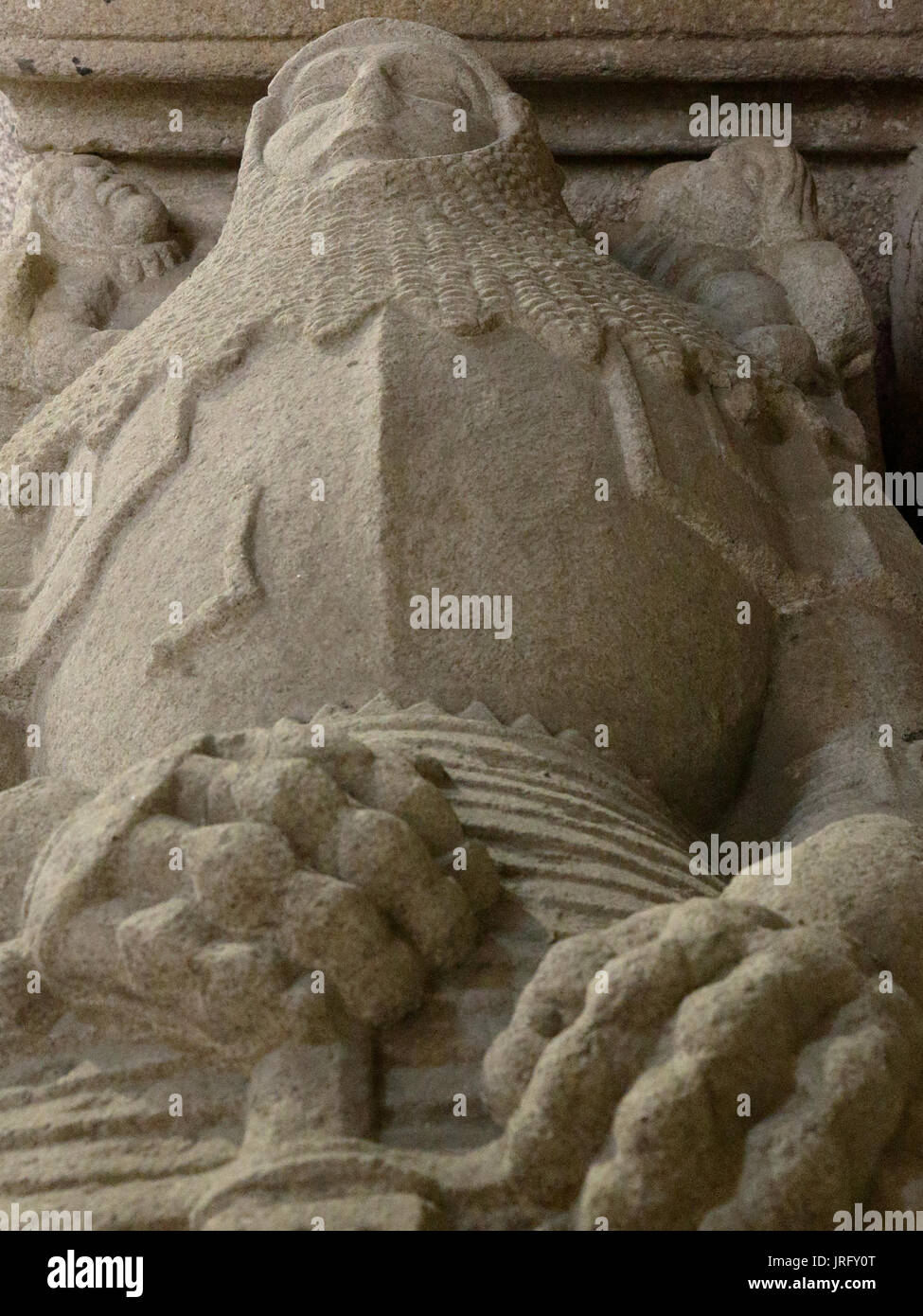 A close view of a stone low relief of a dead knight with his armour Stock Photo