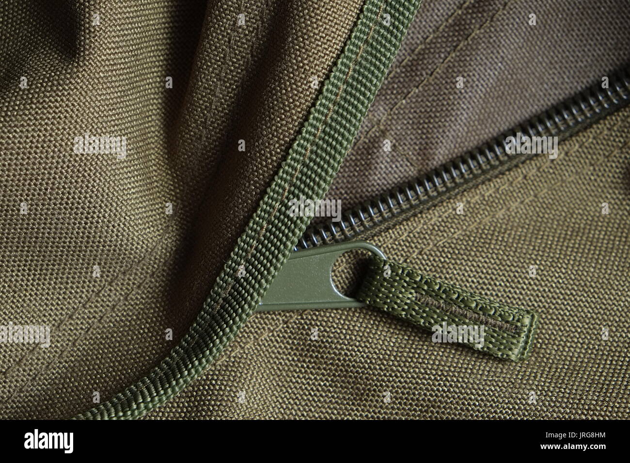 Detail of a tactical holdall army bag, showing canvas and zipper Stock Photo