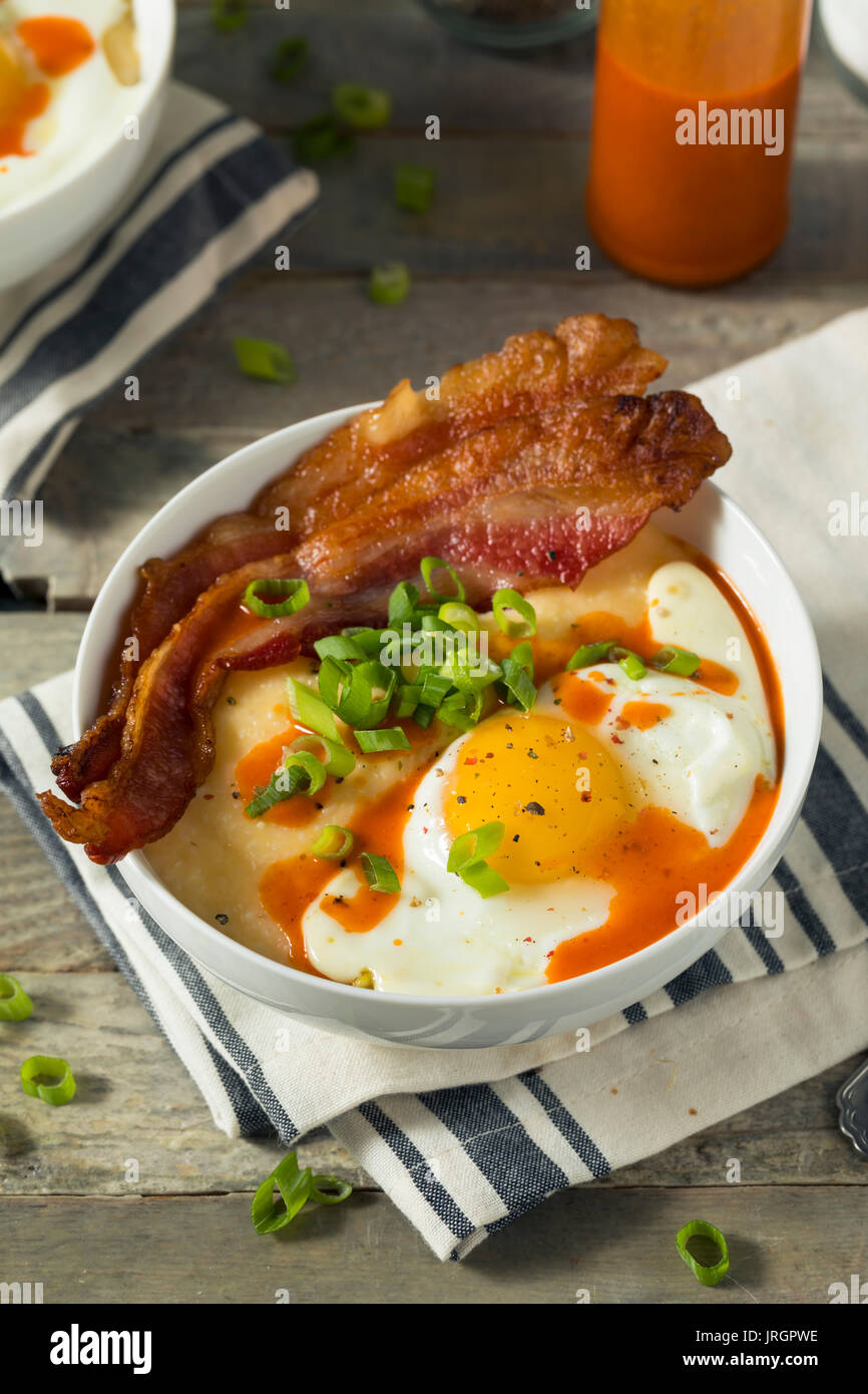 Homemade Cheesy Breakfast Grits with Eggs and Bacon Stock Photo Alamy